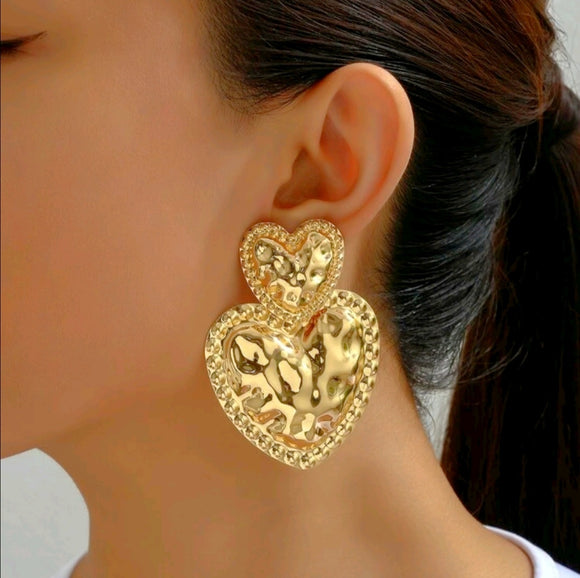 Exaggerated heart shaped gold earrings with stainless studs