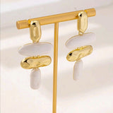 Exaggerated geometric white gold dangle earrings