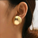 Round shaped gold earrings