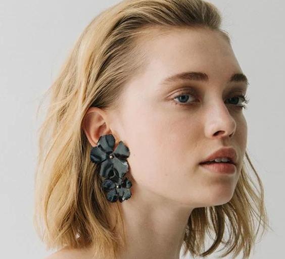 black flower earring statement