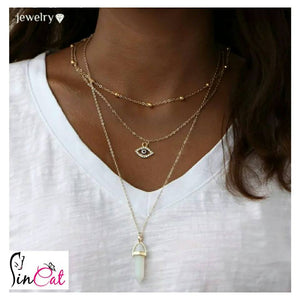 Golden Multilayer necklace woth evil eye and stone of luck