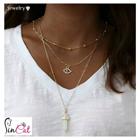 Golden Multilayer necklace woth evil eye and stone of luck
