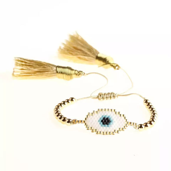 Golden beads evil eye bracelet with tassels