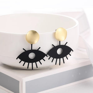 Eye shape gold black drop earrings