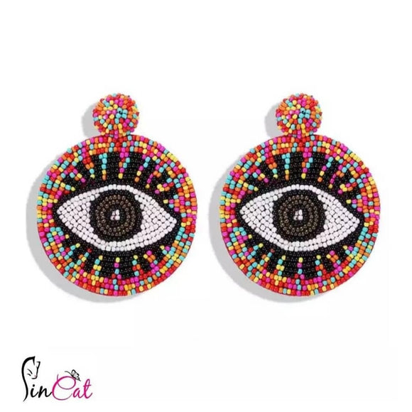 Pink beads round eyes hand made earrings