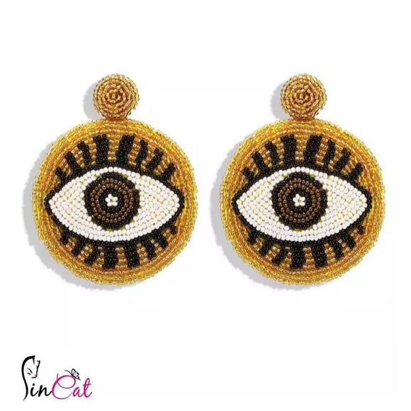 Golden beads round eyes hand made earrings