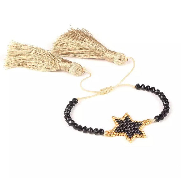 Gold black star beaded bracelet with tassels